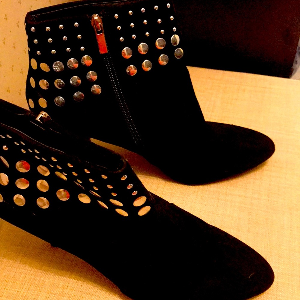 Short ankle boot heel with side zipper and silver studs.  Gently worn